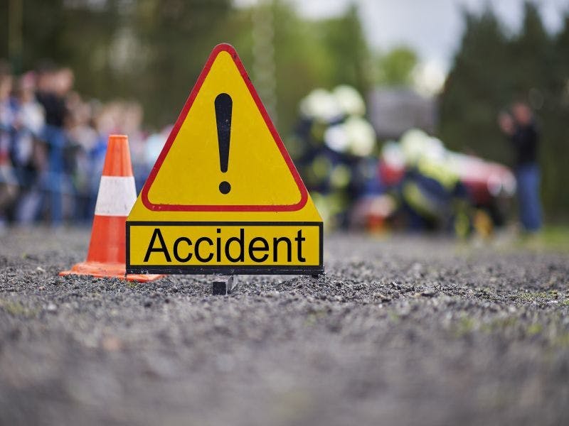 Photo of a road sign indicating an accident ahead.