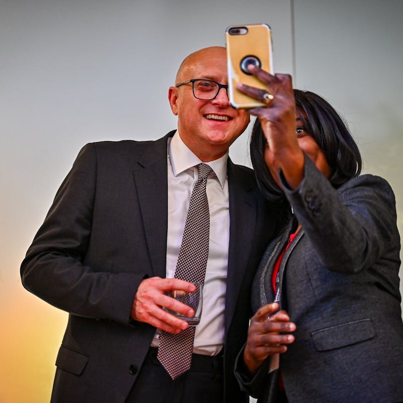 HHJ Burrows and conference guest taking a selfie
