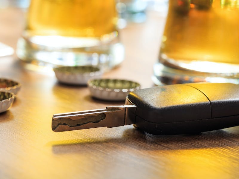 Car keys with beer bottle lids and pints