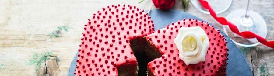 red heart cake cut in two