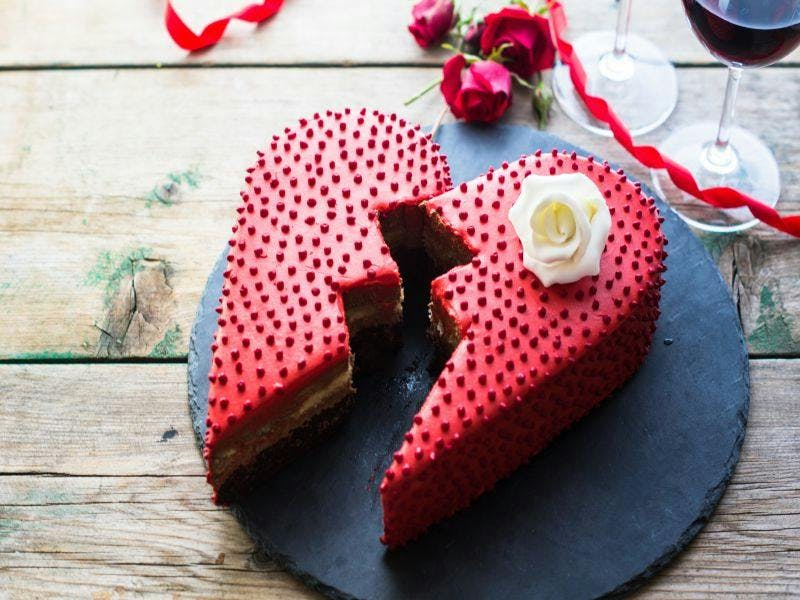 red heart cake cut in two